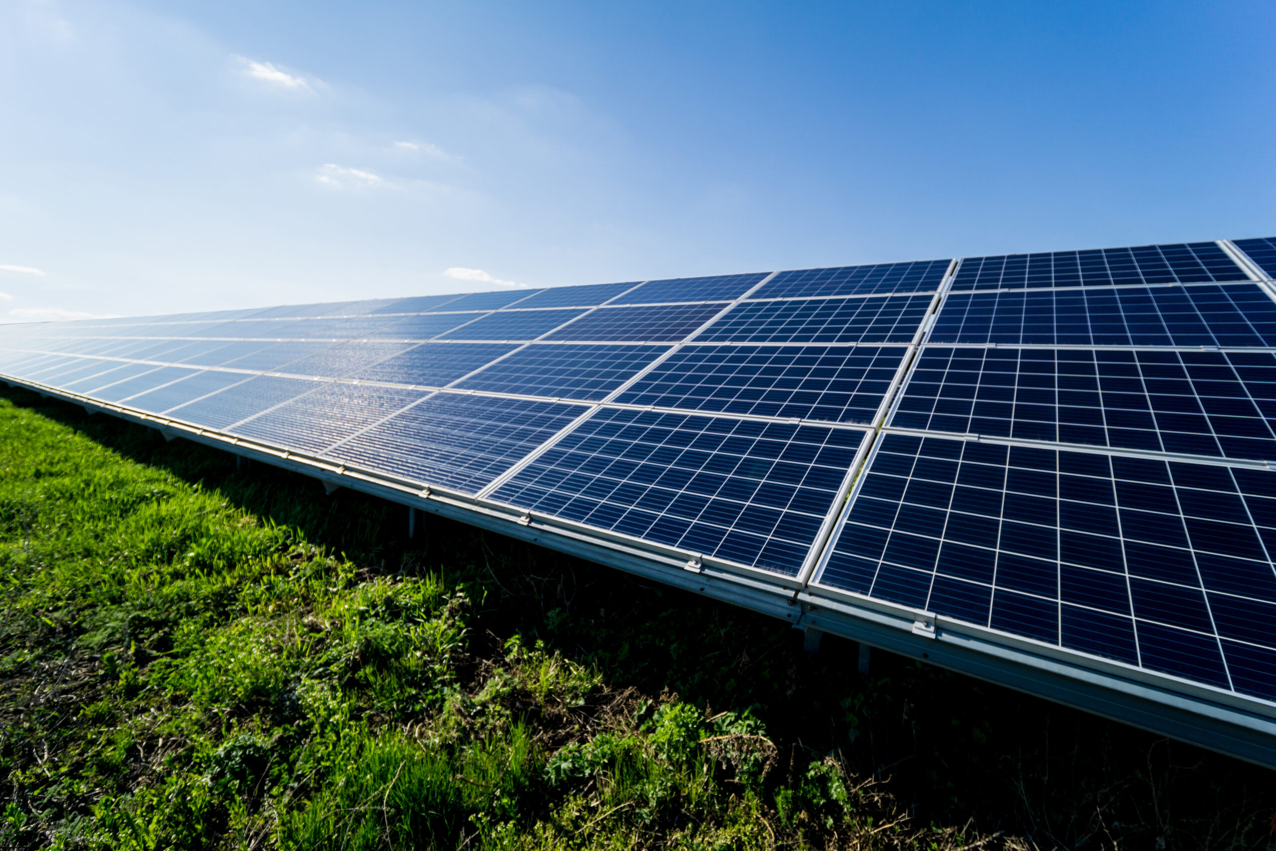 Photovoltaic solar panels on blue sky background.